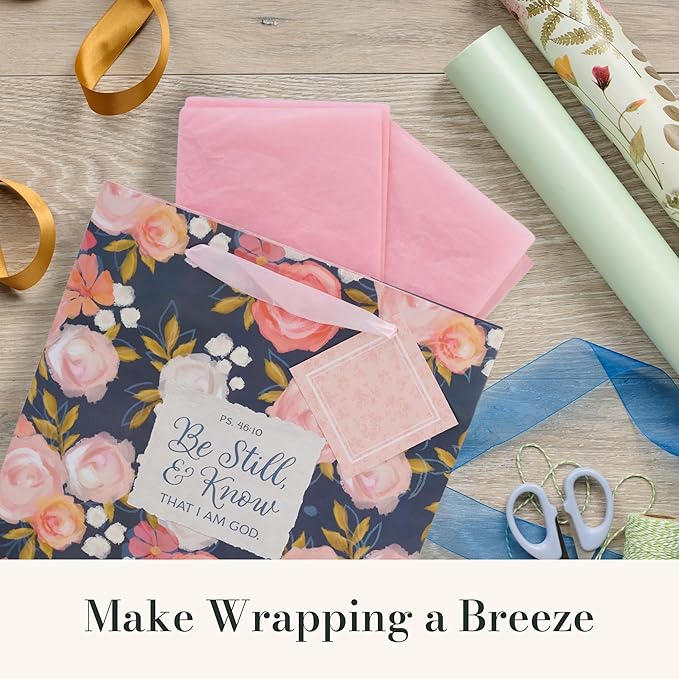Christian Art Gifts Large Portrait Inspirational Scripture Gift Bag, Tag & Wrapping Tissue Paper Set for Women: Be Still & Know Bible Verse, Satin Ribbon Handles, Navy Blue & Pink Multicolor Floral
